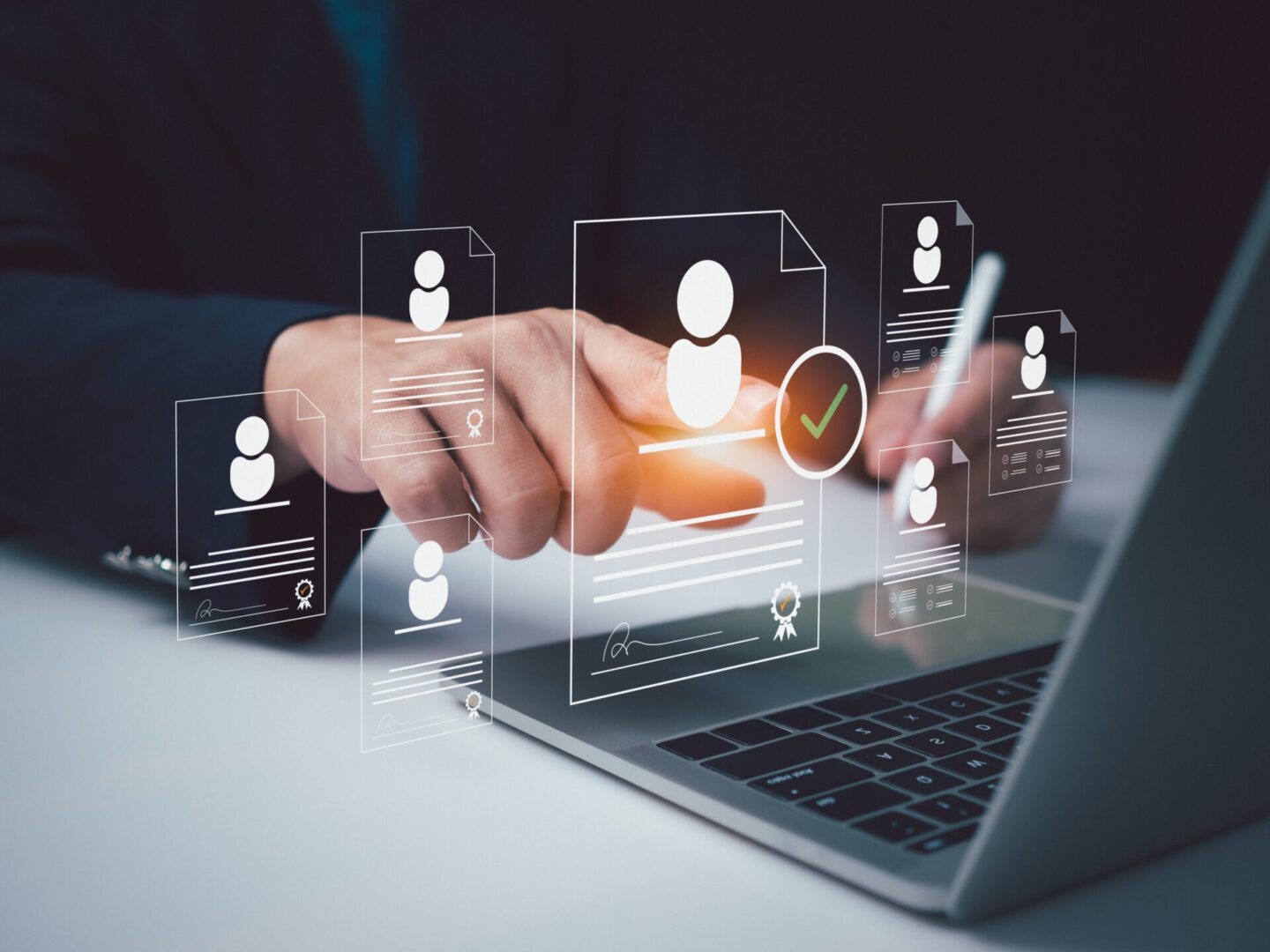 The image shows a person interacting with a laptop, surrounded by digital icons representing resumes or candidate profiles. A highlighted profile with a green checkmark suggests a successful selection or hiring decision, indicating a recruitment or HR tech process.