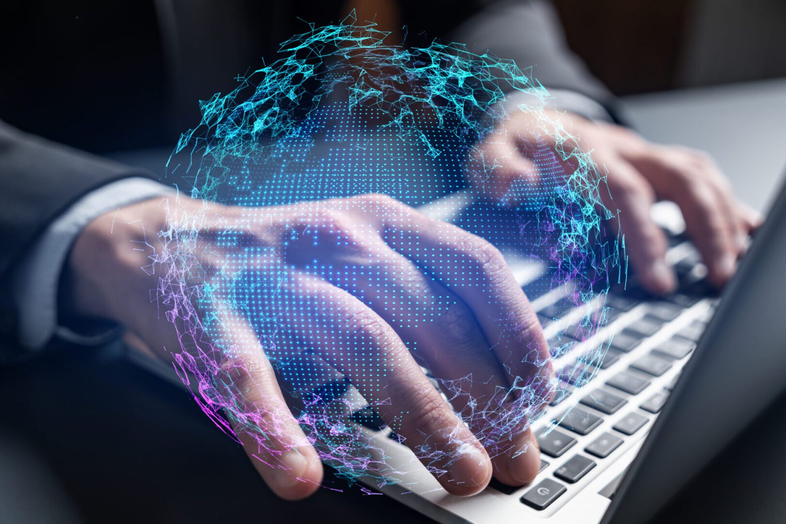 Close-up of a businessman’s hands typing on a laptop keyboard, overlaid with a glowing holographic globe made of blue and purple digital dots and connecting lines, symbolizing global networks and technology.
